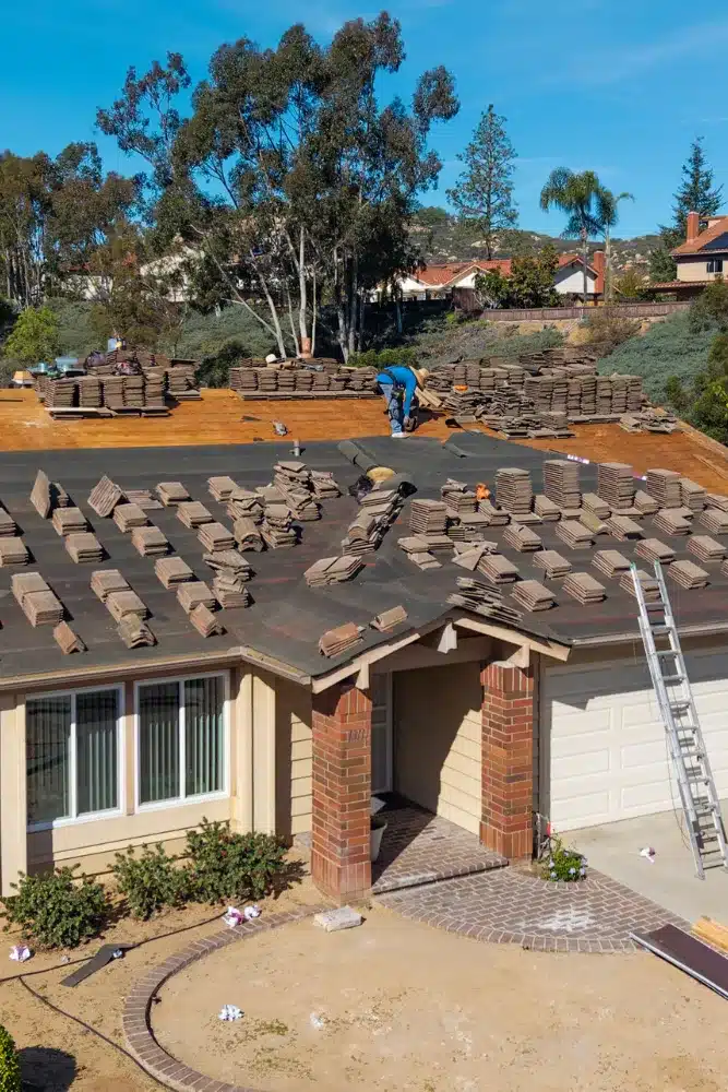 Untitled design (17) Roof replacement in progress on a San Diego home with stacked tiles